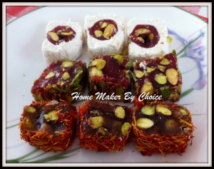 These are all  Pomegranate with honey and pistachio wrapped in marshmallow, wrapped  with crushed pistachio and wrapped with saffron